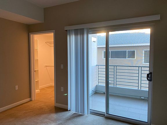 Walk in closet and balcony in the master bedroom