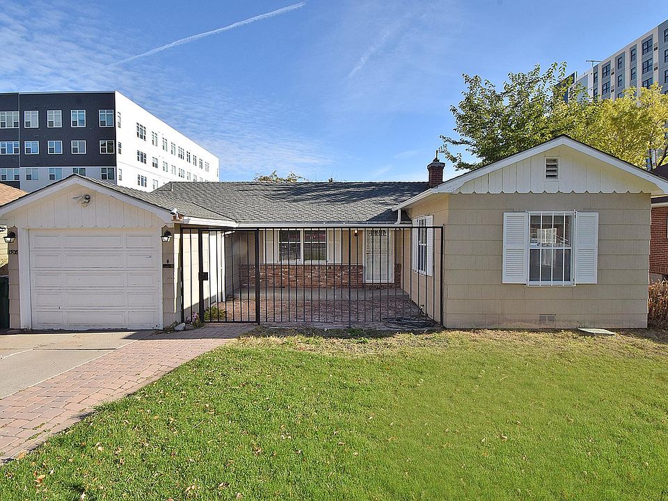 Front of house/ courtyard area and garage.