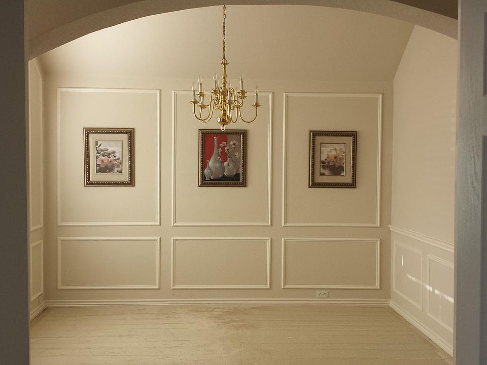 Original picture of formal living or dining area up front taken in 2016. we still have artwork if you want to hang. Carpet has been removed.