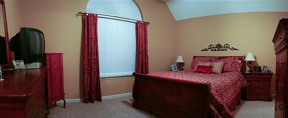 Master bedroom with vaulted ceiling
