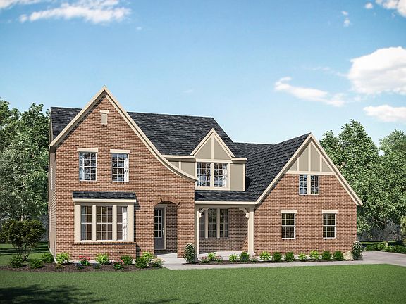 custom home with brick and stucco