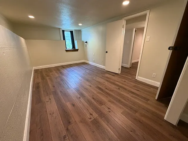 Bedroom 1- Egress window, very large room, two closets, raised ledges for storage/decorations, custom wood window sill