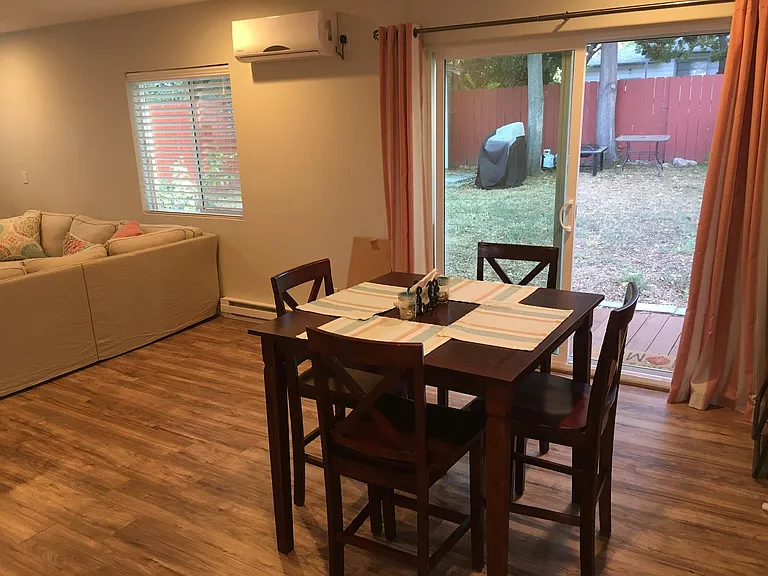 Dining space looking towards back yard with back living space to the left.