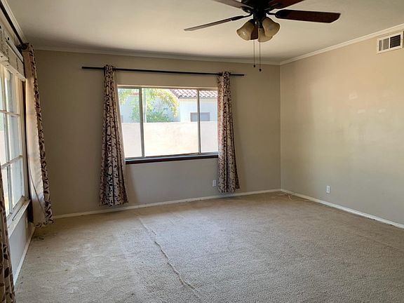 Light & Bright Spacious Living Room with Lighted Ceiling Fan