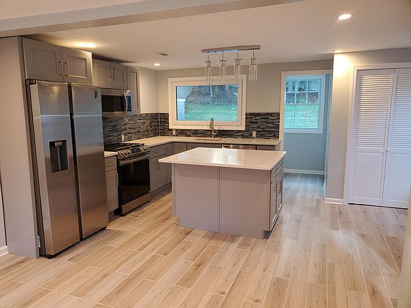 Great island space with modern pendant lights.