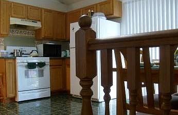 Eat-in kitchen with deck outside of patio doors