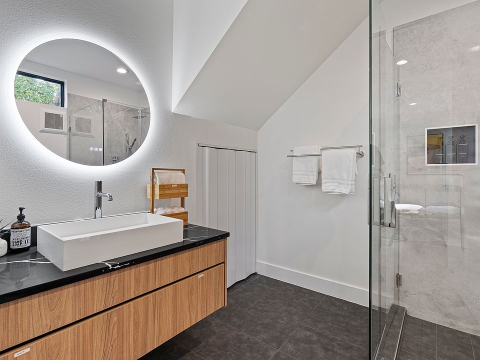 Floating vanity with LED mirror.