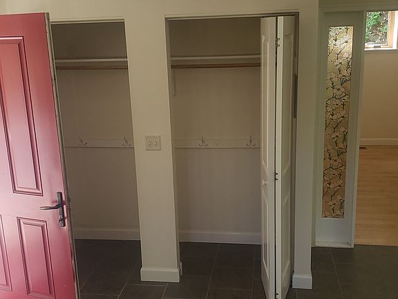 Dual coat closets off foyer by main entrance. Study entrance on right.