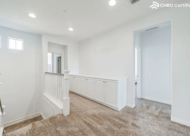Second Floor hallway with ample Linen Storage