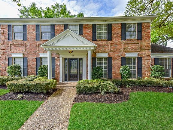 Love the awesome shutters that frame the many windows in this 5 bedroom, 3.5 bath home