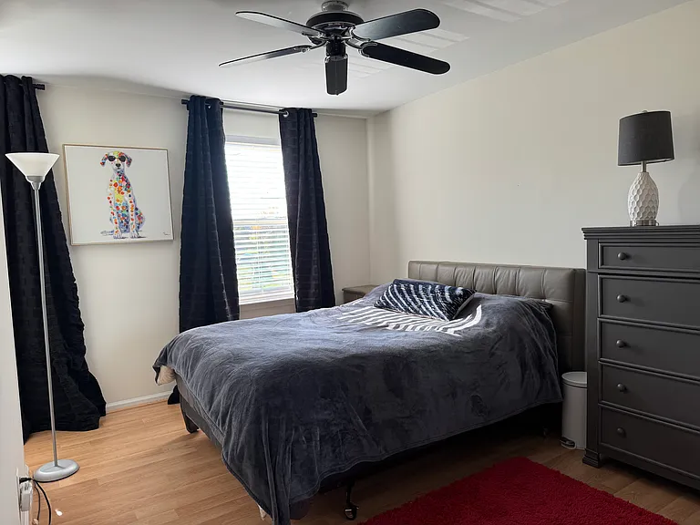 Queen bed, closet, blinds and black out shades.