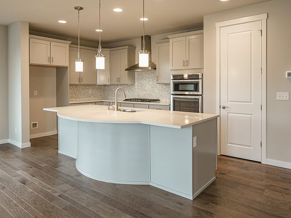 Model Representation - Spacious kitchen with curved center island