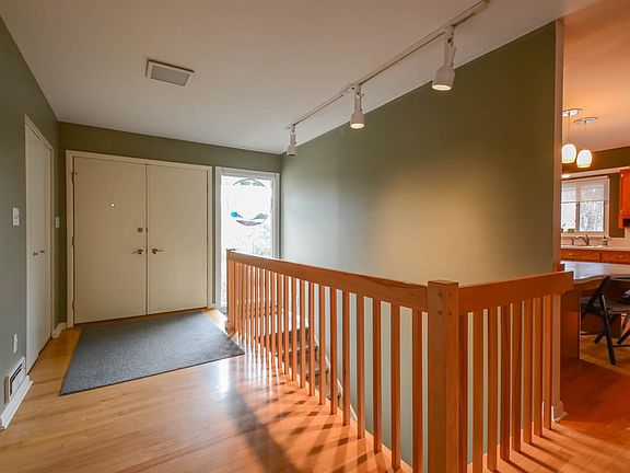 Bright entry with new hardwood flooring.