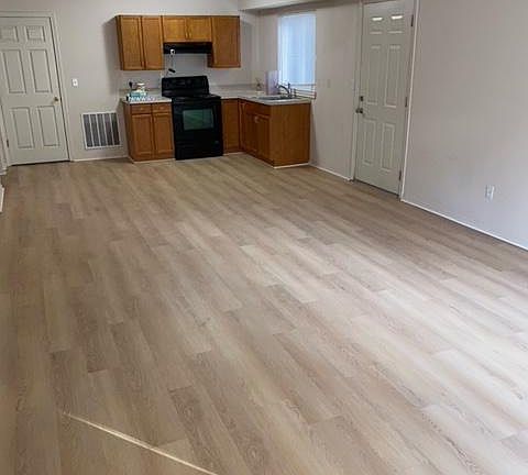 Kitchen. Door on right is the entrance. Door on the left is to the garage.