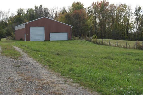 A large barn holds lots of cars, plus it offers stalls for your animals.