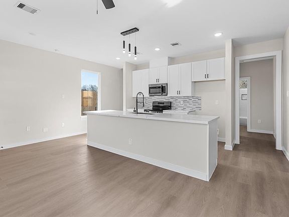 Open kitchen and living room floor plan.