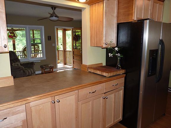 kitchen with stainless steel appliances and custom cabinets