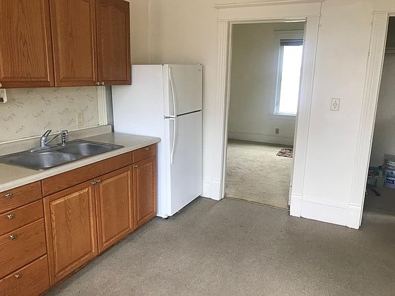 Kitchen looking into bedroom