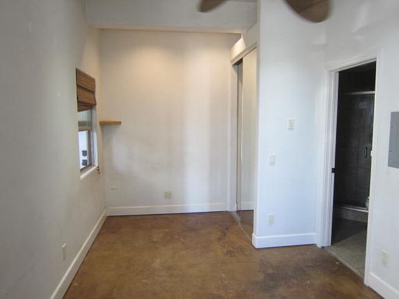 Studio, Stained Concrete Floors, Mirrored wardrobe Doors, Ceiling Fan, Good Ocean Breeze, F.P. and a 10' ceiling.