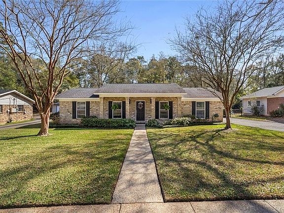 This one story house has a covered porch.  Room to place chairs to sit outside.