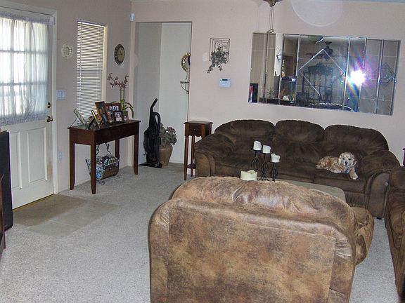 Living room w/design ceiling fan.