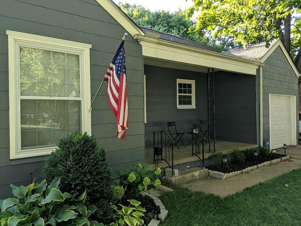 Lovely exterior with siding and new windows.