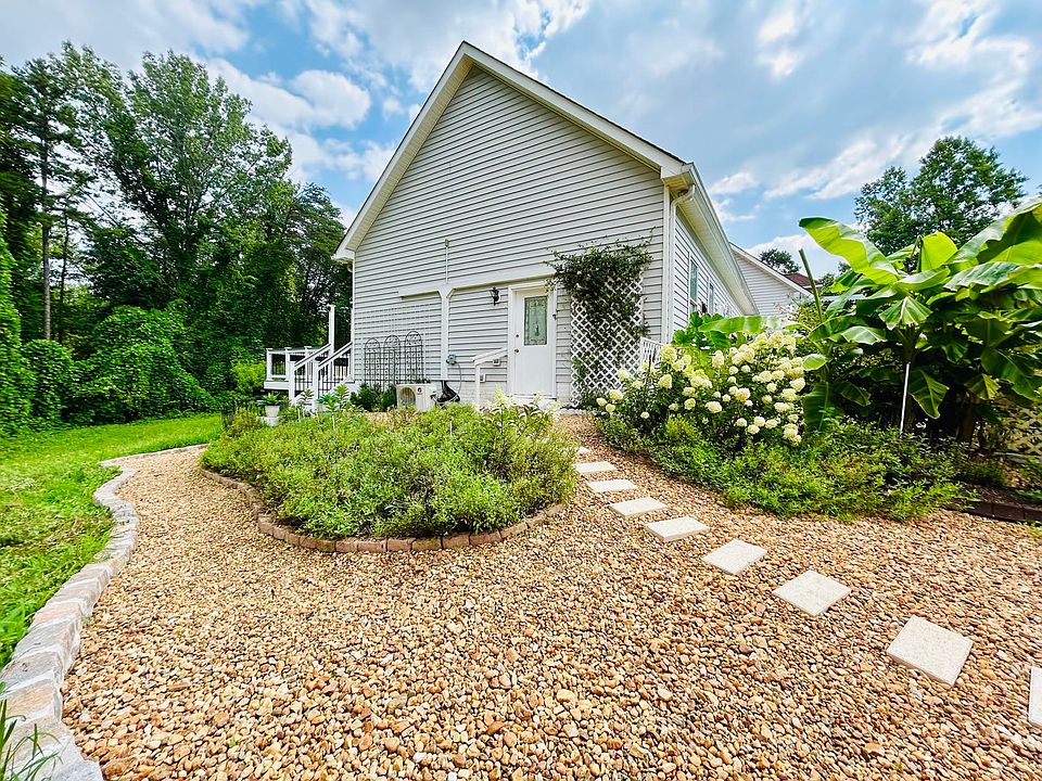 thoughtfully designed private entrance with garden pathway and charming greenery