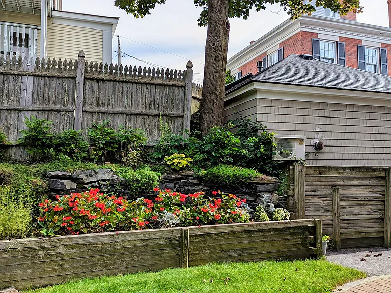 Portion of shared back garden and sitting area.