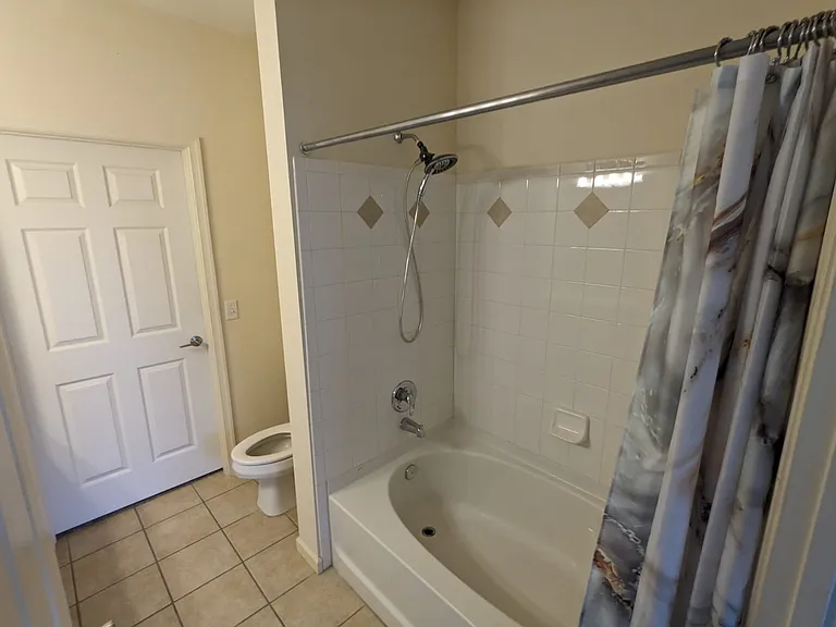 Second bathroom with linen closet