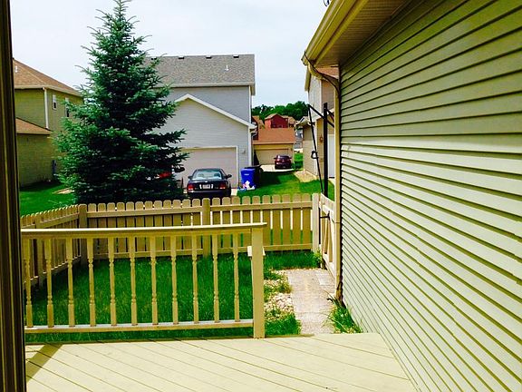 Unity Way Looking out of Breakfast Nook to Deck and Fenced Y