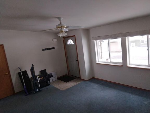 Living room and front entrance. (Move-out still in progress,)