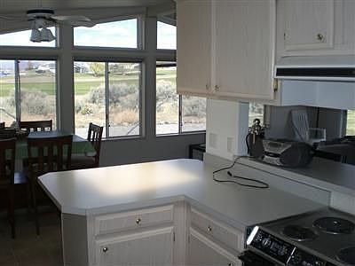 View from your kitchen to the west , Golf Course mountains and sunsets over the Lake and the Mountai