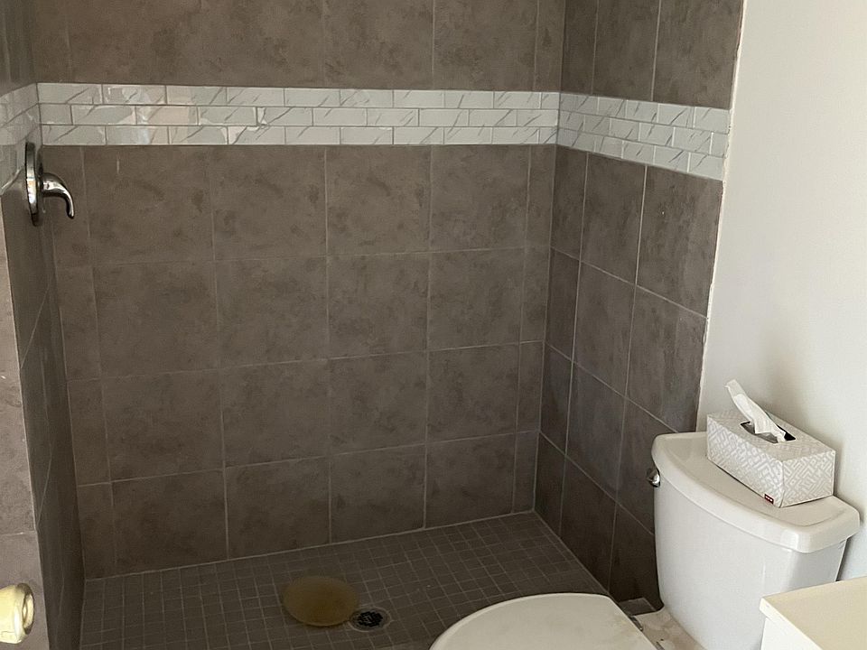 Brand new bathroom with a beautiful tiled walk-in shower.