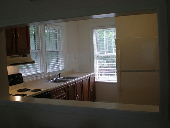 Kitchen from formal dining room pass through window
