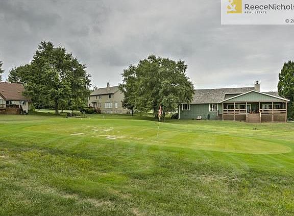 House backs to neighborhood 9-hole golf course. See how big the deck is from the back to cheer the players on.