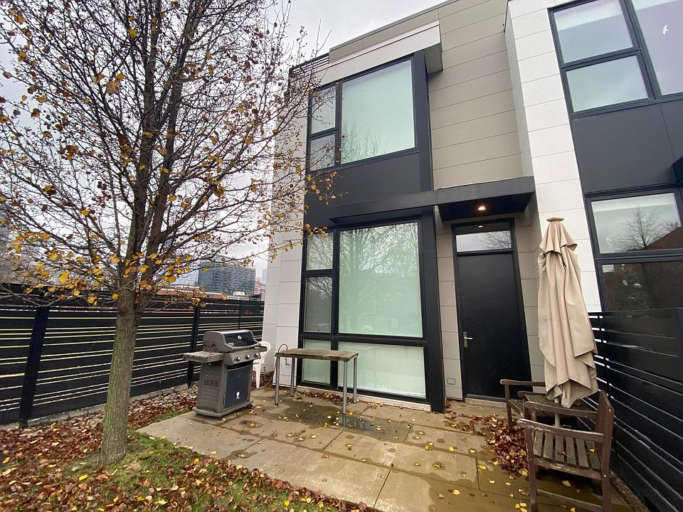 Front of home gated with deck