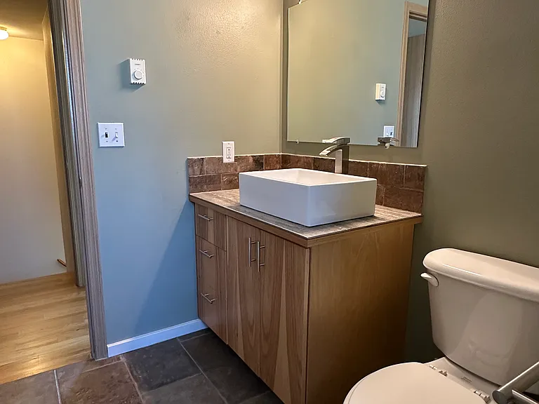 Upstairs bath with hickory cabinet fronts