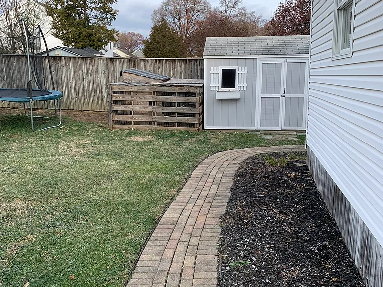 Back yard (two sheds, raised garden, six foot privacy fence)
