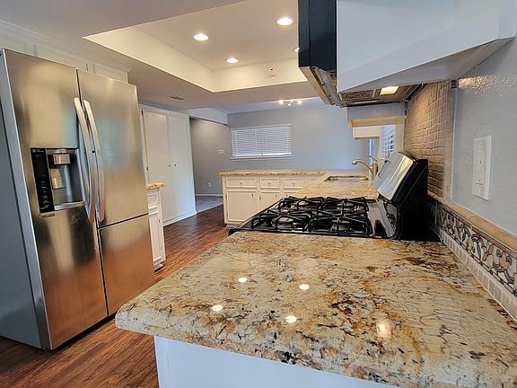 kitchen with refrigerator/stove/dishwasher/micro hood
