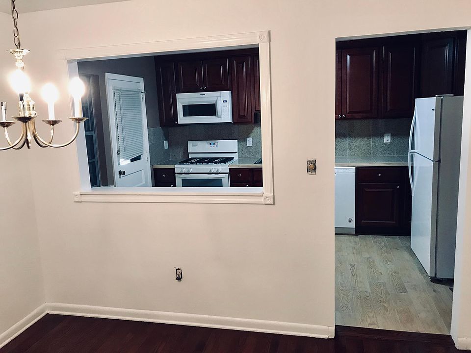 Dining room through kitchen with rear entrance
