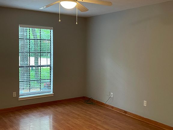 Front Living room with plenty of space and ceiling fan.