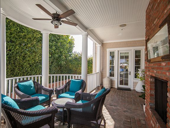 Wrap around porch with working fire place and seating