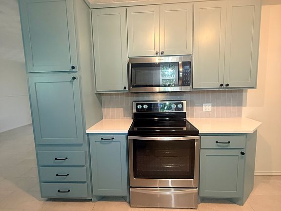 Beautiful Upgraded cabinets with oven and microwave.