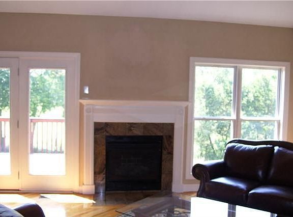 Great room, open from dining room has vaulted ceiling, gas log fireplace