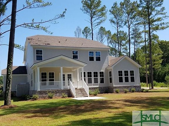 Beautiful view of the rear exterior of the home with 18ft wide x 12ft deep covered porch. Enjoy the
