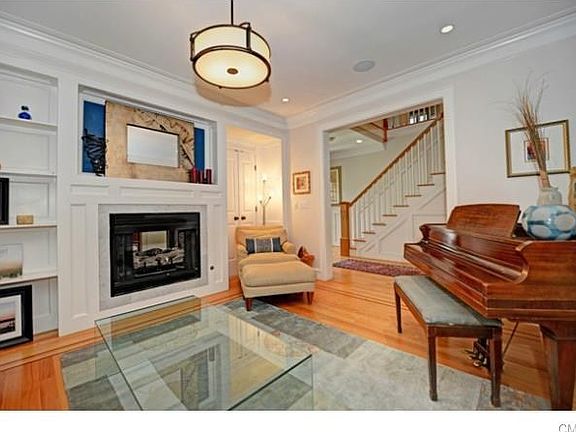 The Formal Living Room is large enough to fit a  baby grand piano and host a sitting area, it is both spacious and intimate.