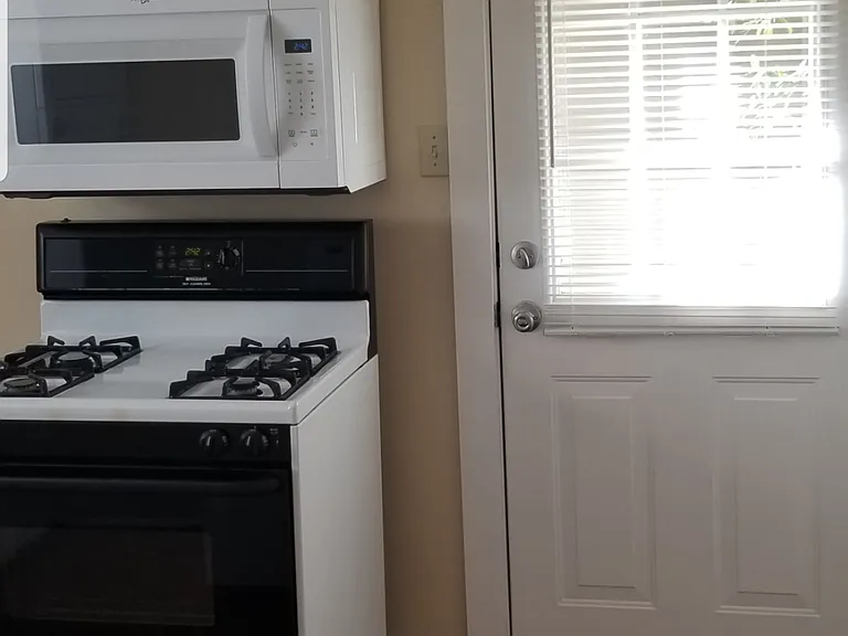 side entry from kitchen makes taking garbage out easy