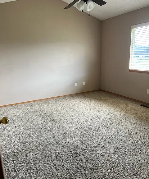 Master bedroom with vaulted ceiling