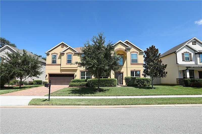 Welcome home to 4923 Scenic Vista Dr in desirable, gated community of East Lake Park!