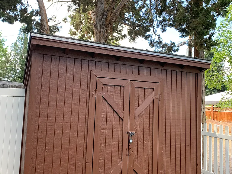 Side yard shed on concrete pad